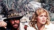 Richard Chamberlain a Sharon Stone ve filmu Doly krále Šalamouna, 1985