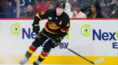 Památný večer pro Quinna Hughese. Bek Vancouveru se zapsal do historie NHL