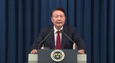 Jihokorejský prezident zůstává u moci. V ulicích protestují desetitisíce lidí