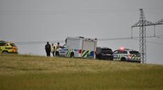 Na poli za Prahou ležela mrtvá žena. Policisté podezřelého z vraždy zadrželi