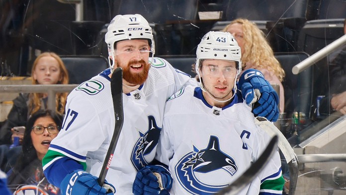 Filip Hronek a Quinn Hughes