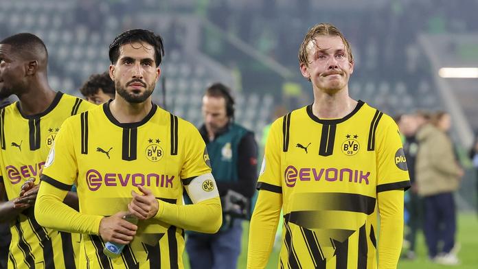 Zklamaní hráči Dortmundu Emre Can a Julian Brandt