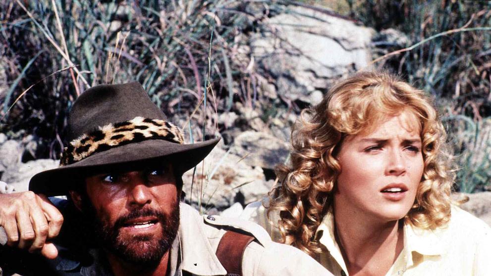 Richard Chamberlain a Sharon Stone ve filmu Doly krále Šalamouna, 1985