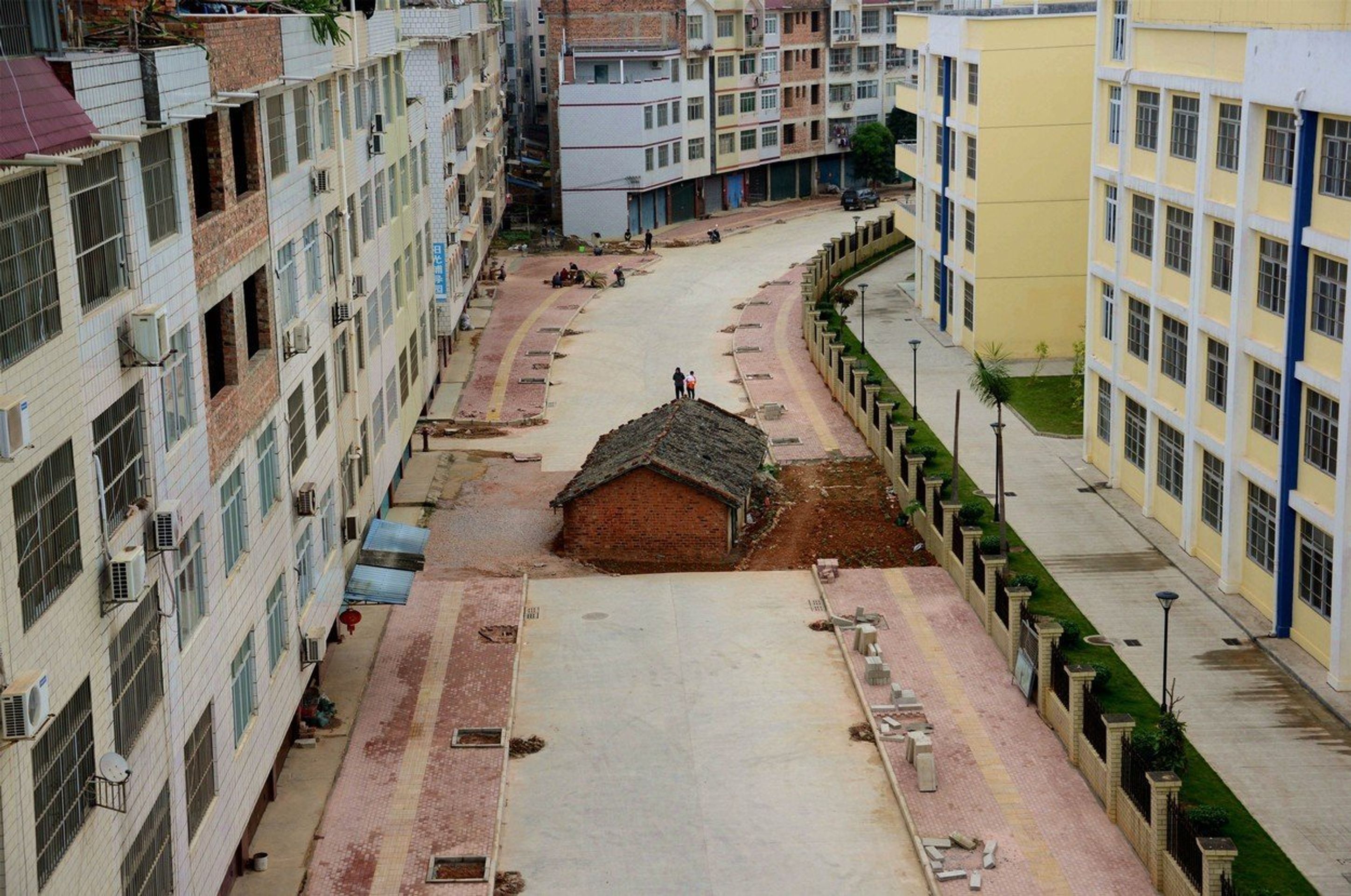 Domy, které odmítli prodat jejich majitelé - Provincie Guangxi - GALERIE: Domy, které odmítli prodat jejich majitelé (4/8)